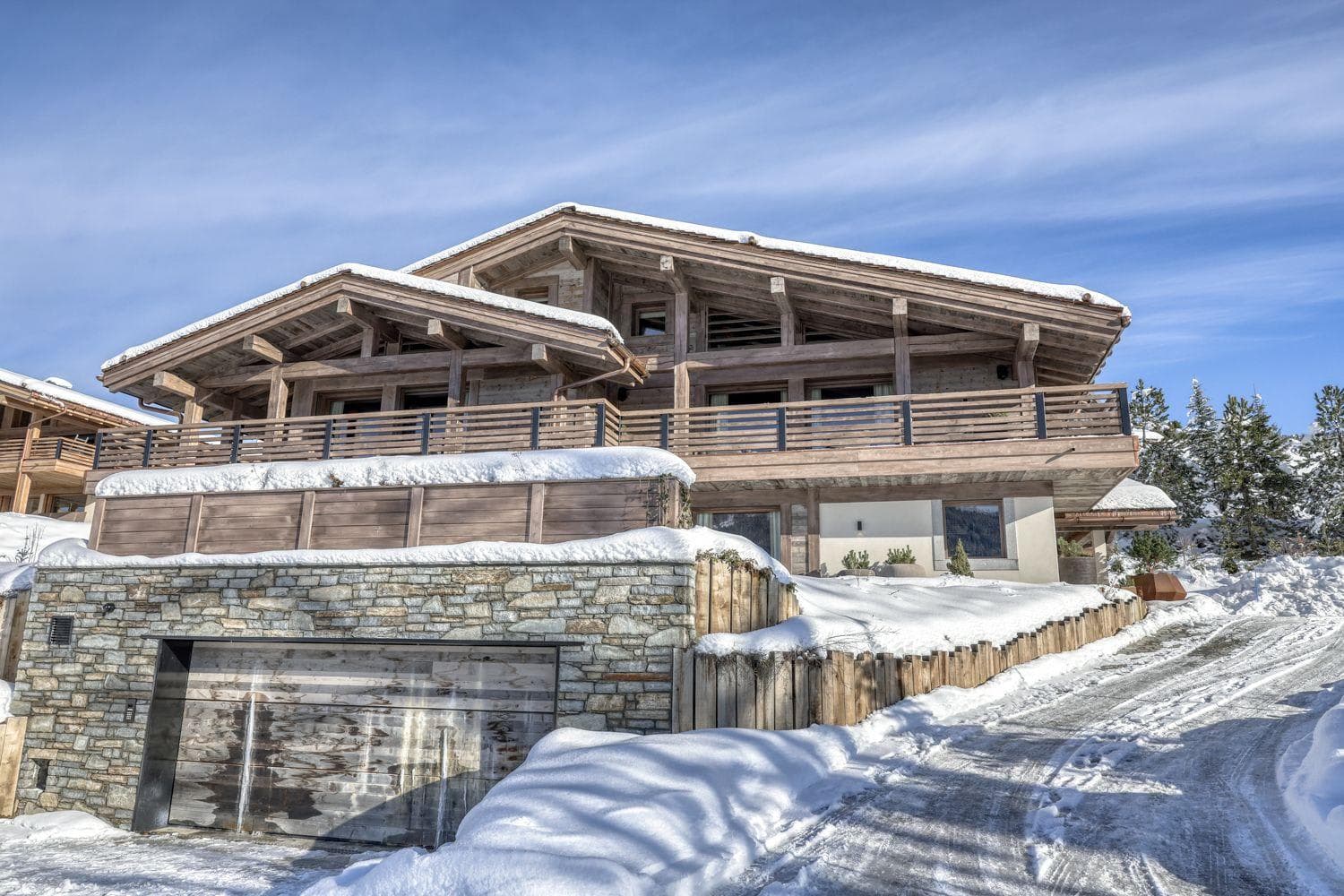 Ski-in chalets with heated underground garage and wrap-around balconies