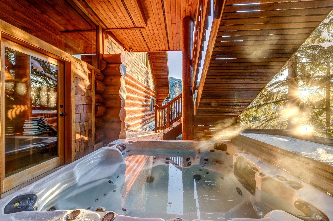 Covered outdoor hot tub seats 6; private forest views