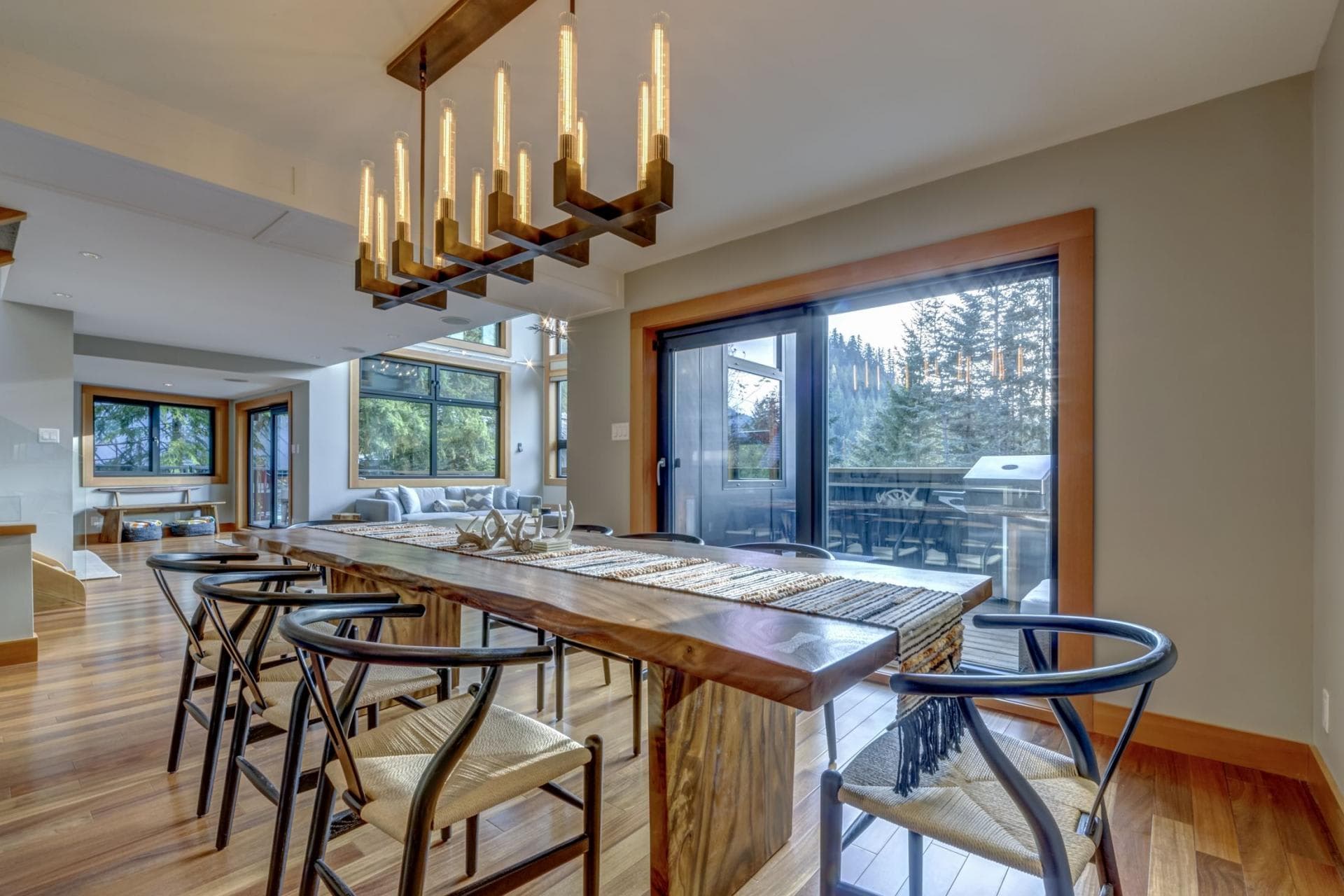 Dining area with live-edge table and access to BBQ deck