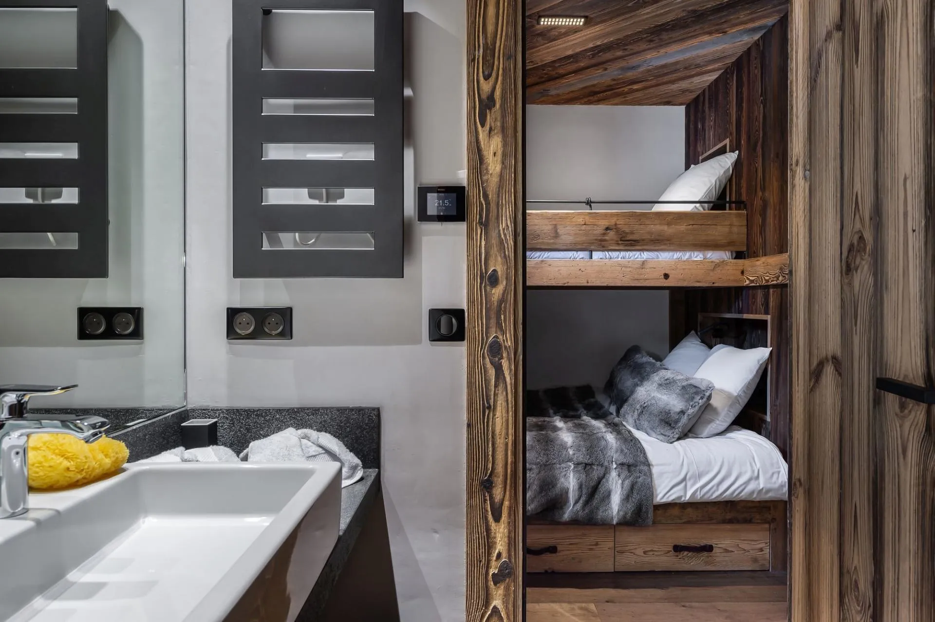 Bathroom basin with adjoining bunk bedroom doorway