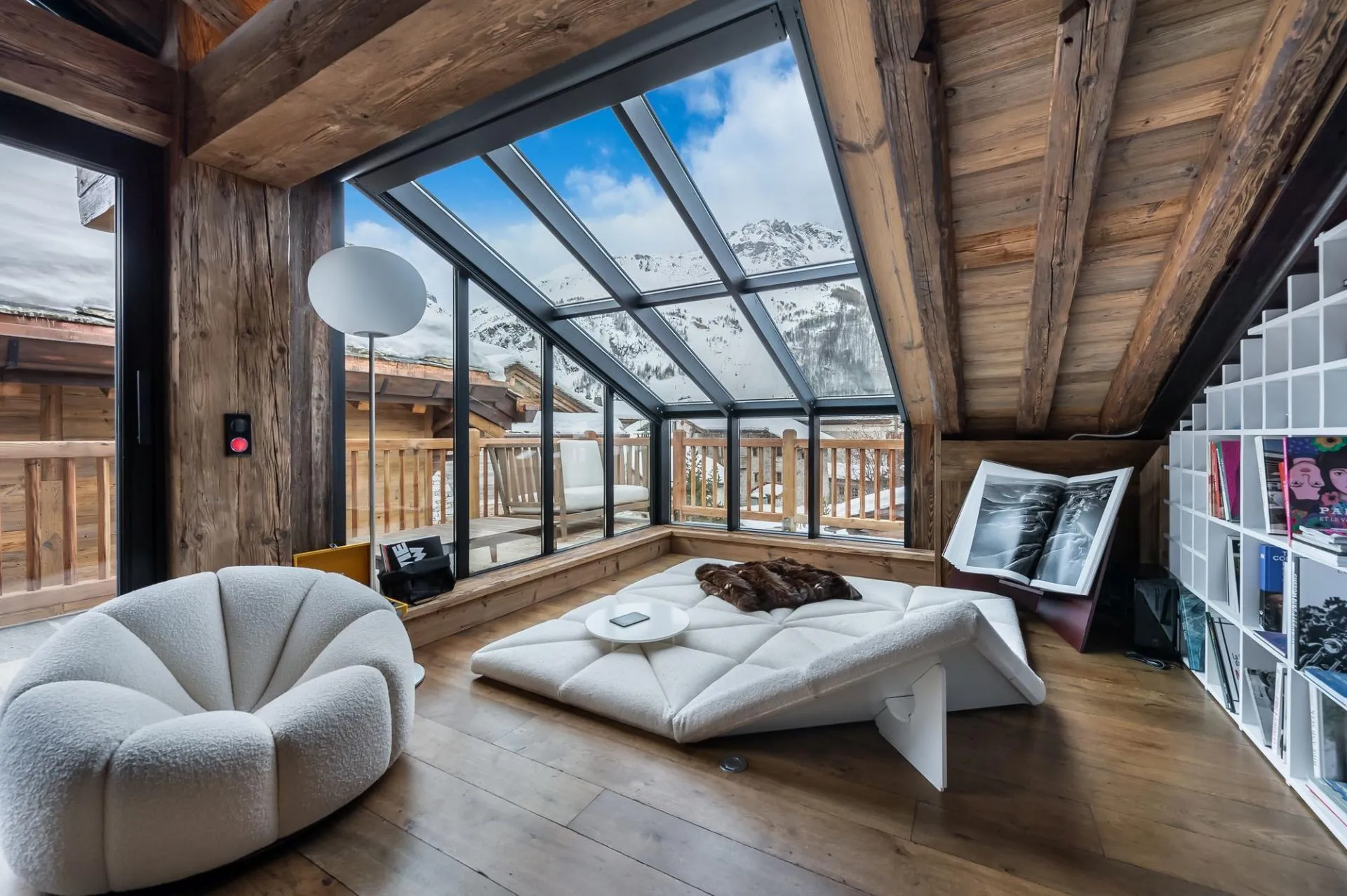 Glazed reading lounge with village and mountain outlook