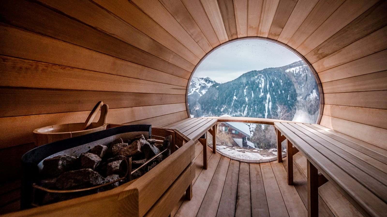 Cedar barrel sauna with bubble window and mountain views