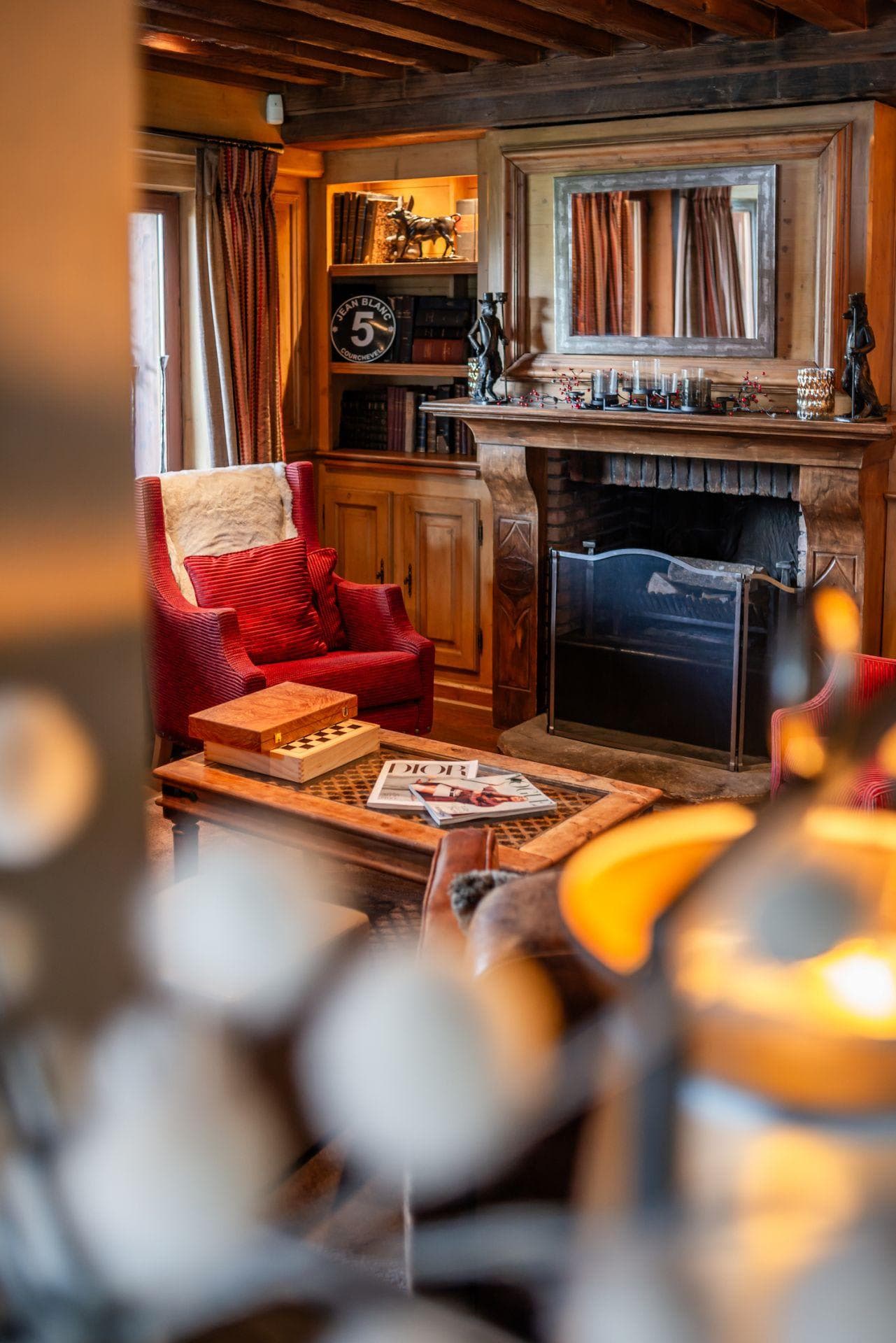 Library with wood-burning fireplace and built-in shelving