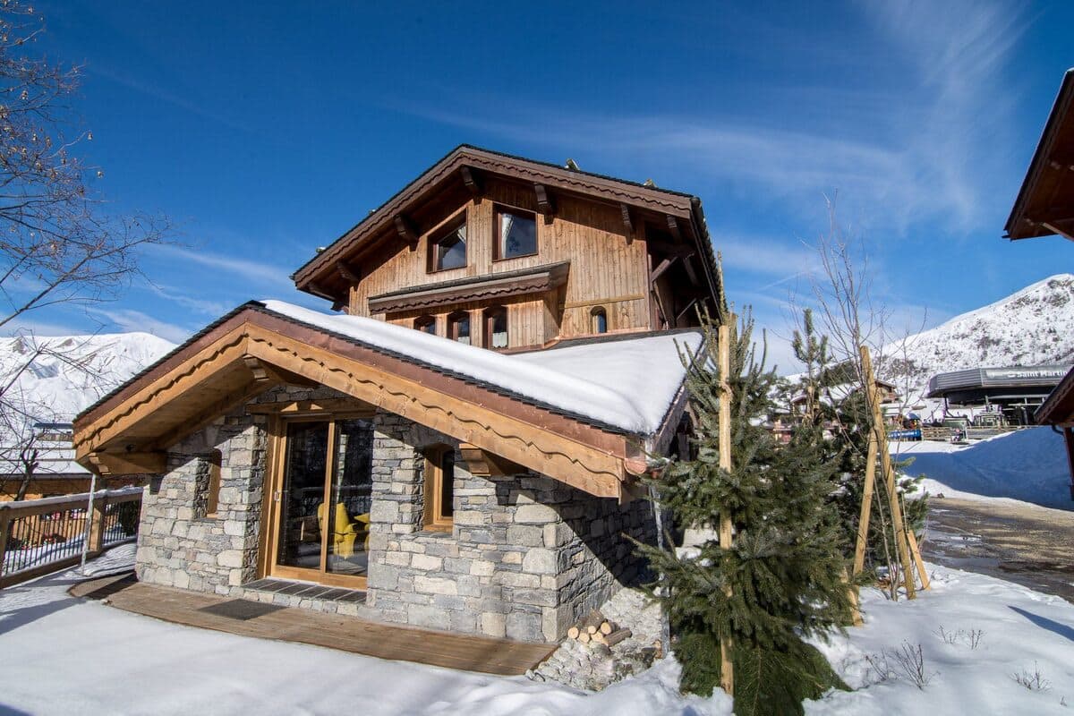 Ski-in/ski-out chalet with stone facade located adjacent to Saint Martin gondola