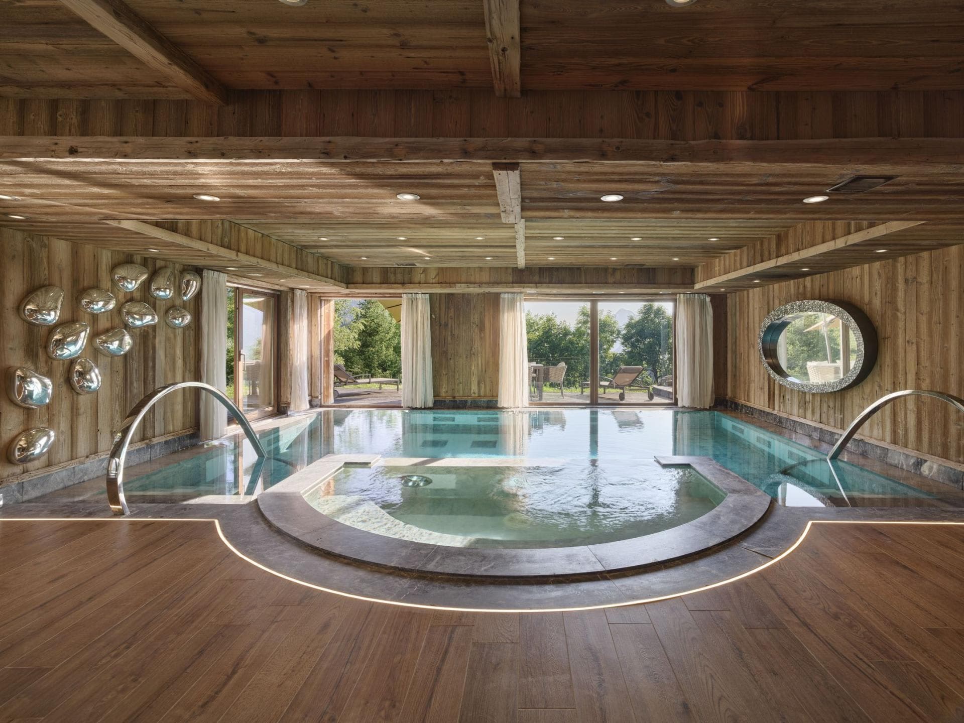 Indoor pool and hot tub with swan neck jets and terrace access