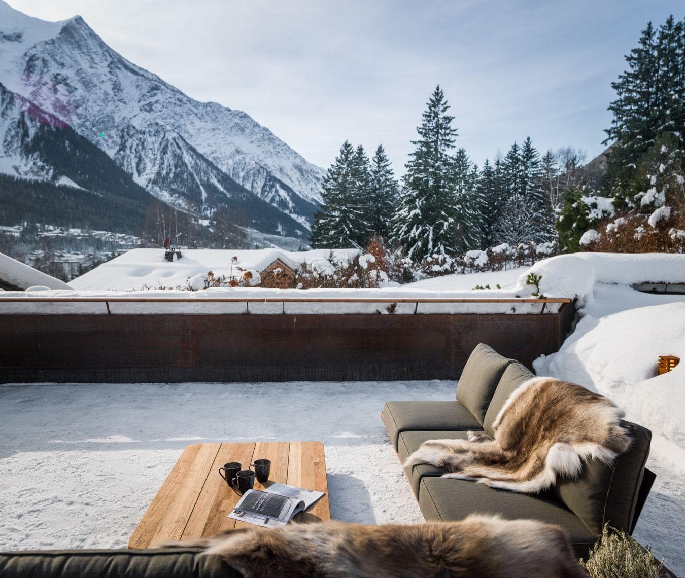 Private terrace with outdoor lounge seating and Mont Blanc views