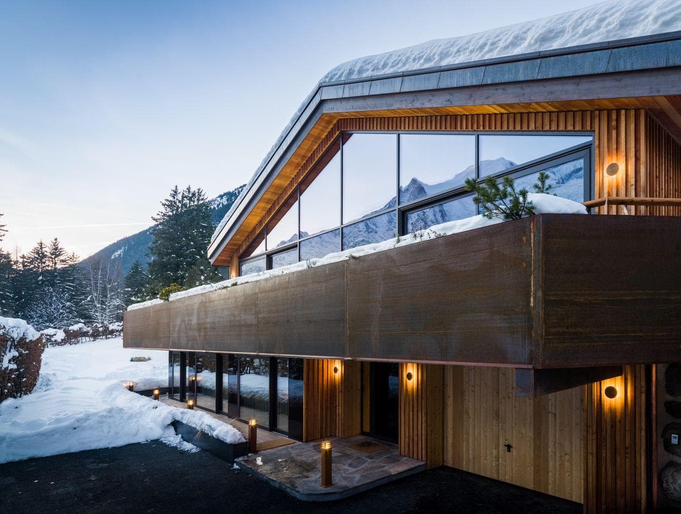Chalet entrance and upper balcony with direct mountain views