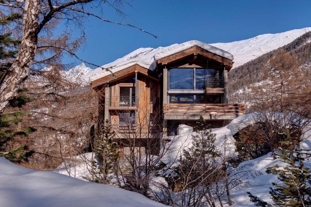 Ski-in chalet with private balconies and floor-to-ceiling mountain views