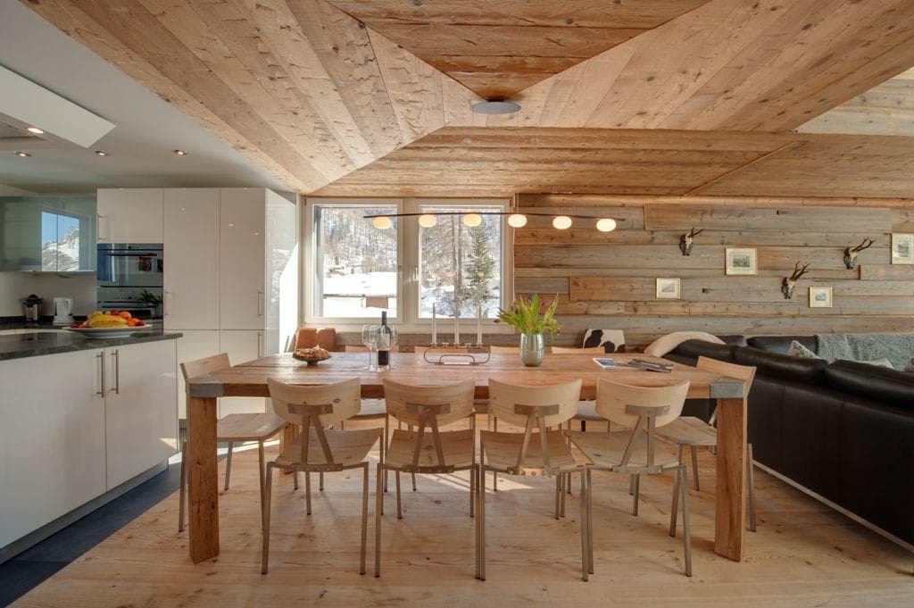 Dining table with seating for 8; mountain views through kitchen windows