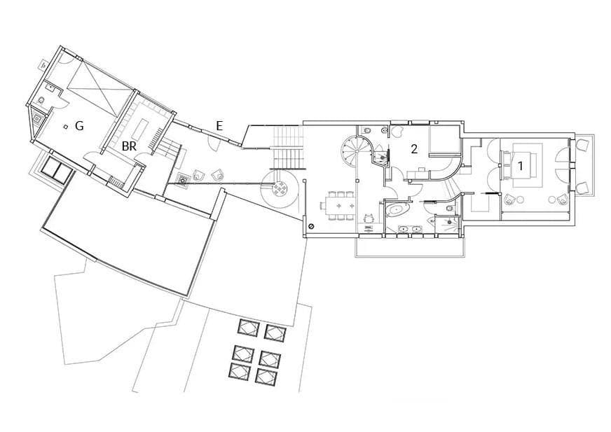 Floor plan: two bedrooms, kitchen, dining area, and garage with workspace