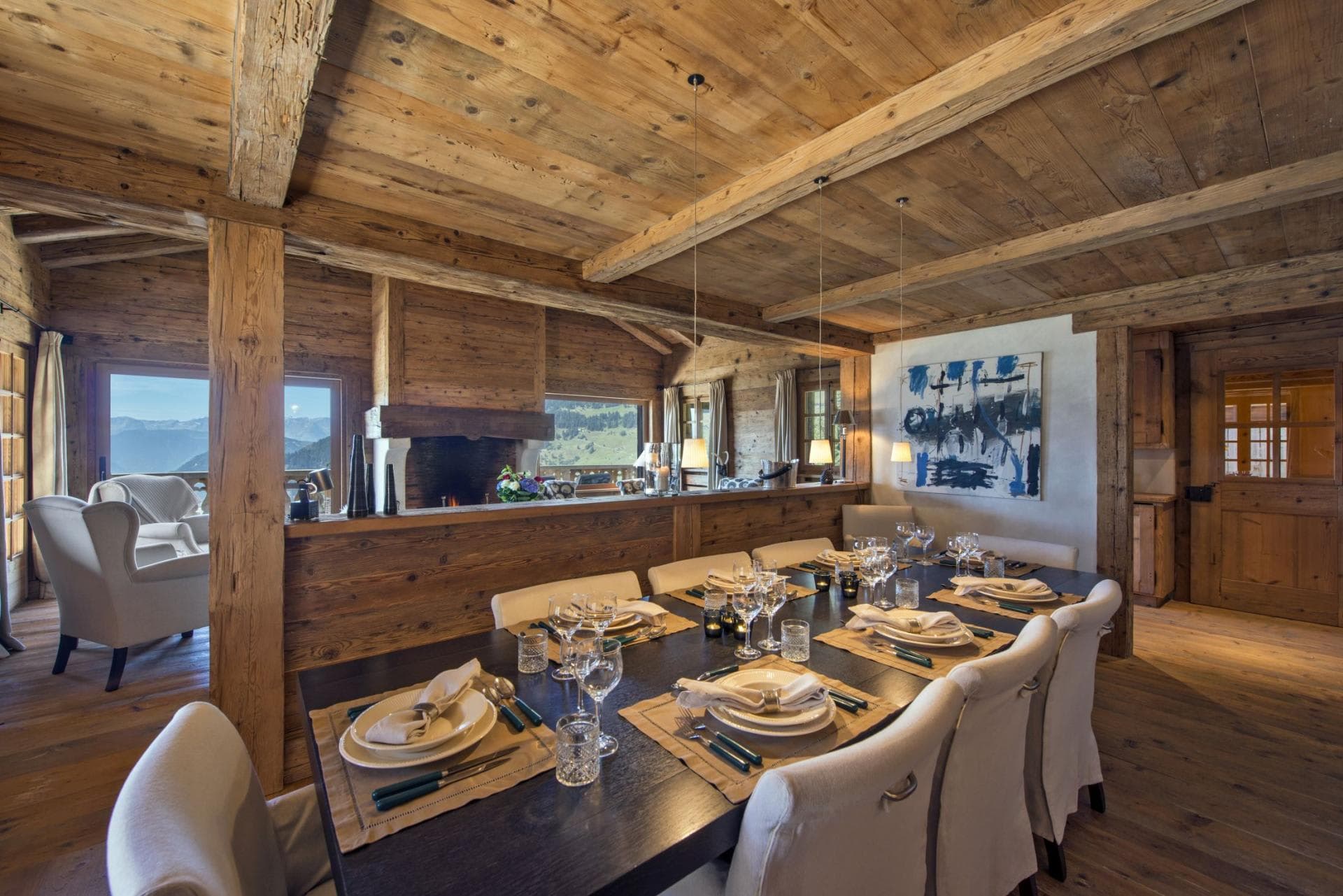 Dining area with seating for 10 near wood-burning fireplace
