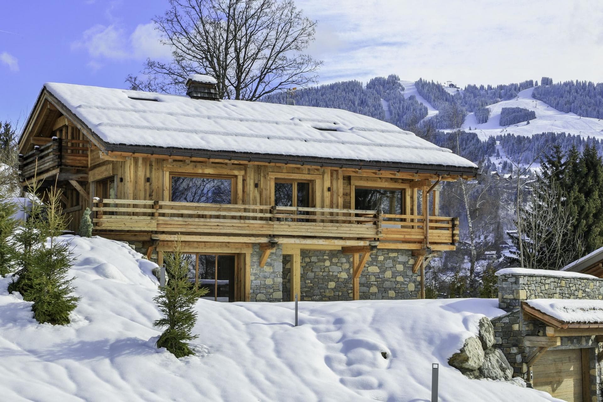 Ski-in chalet with wrap-around balcony and direct view of the slopes