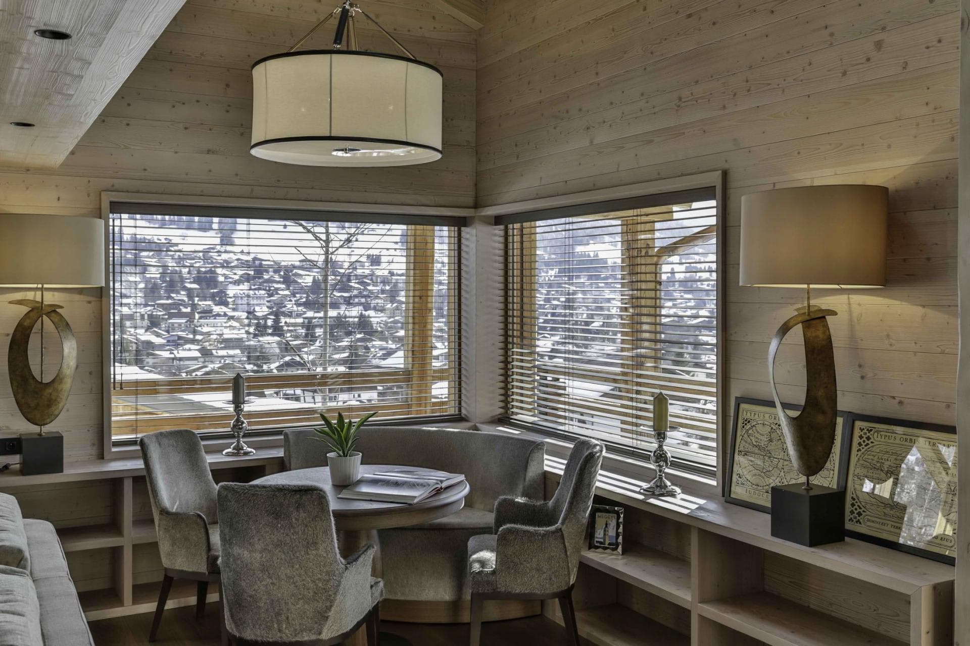 Breakfast nook seats 5 with mountain village views and built-in shelving