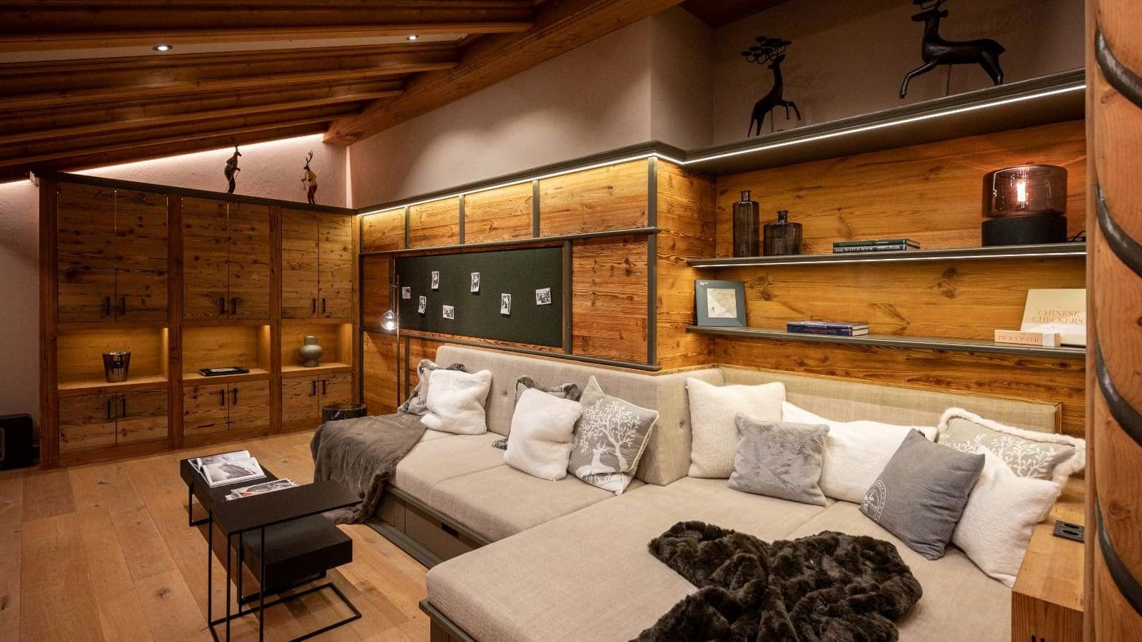 Media room with modular sectional seating and built-in storage cabinets