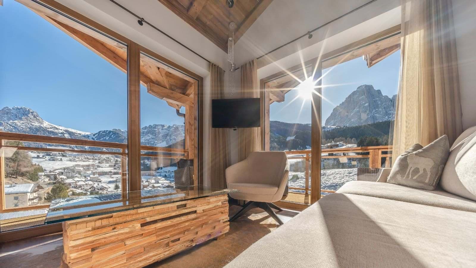 Seating area with mountain views and access to private balcony