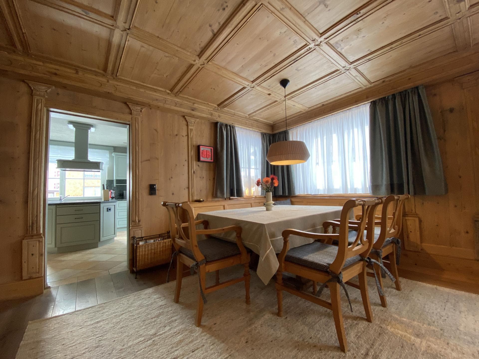 Dining room with traditional wood paneling and built-in bench seating
