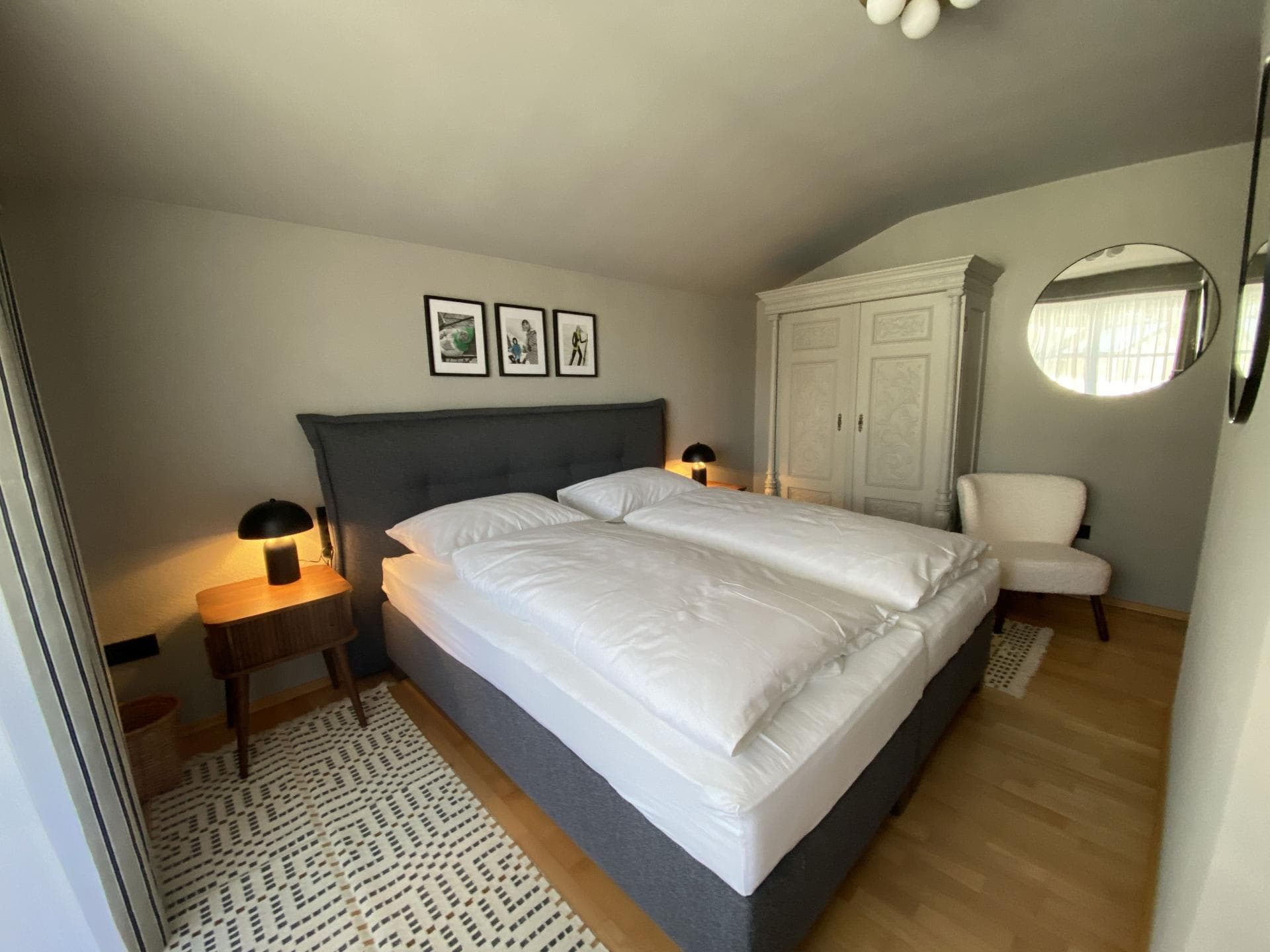Bedroom with king bed and floor-to-ceiling armoire