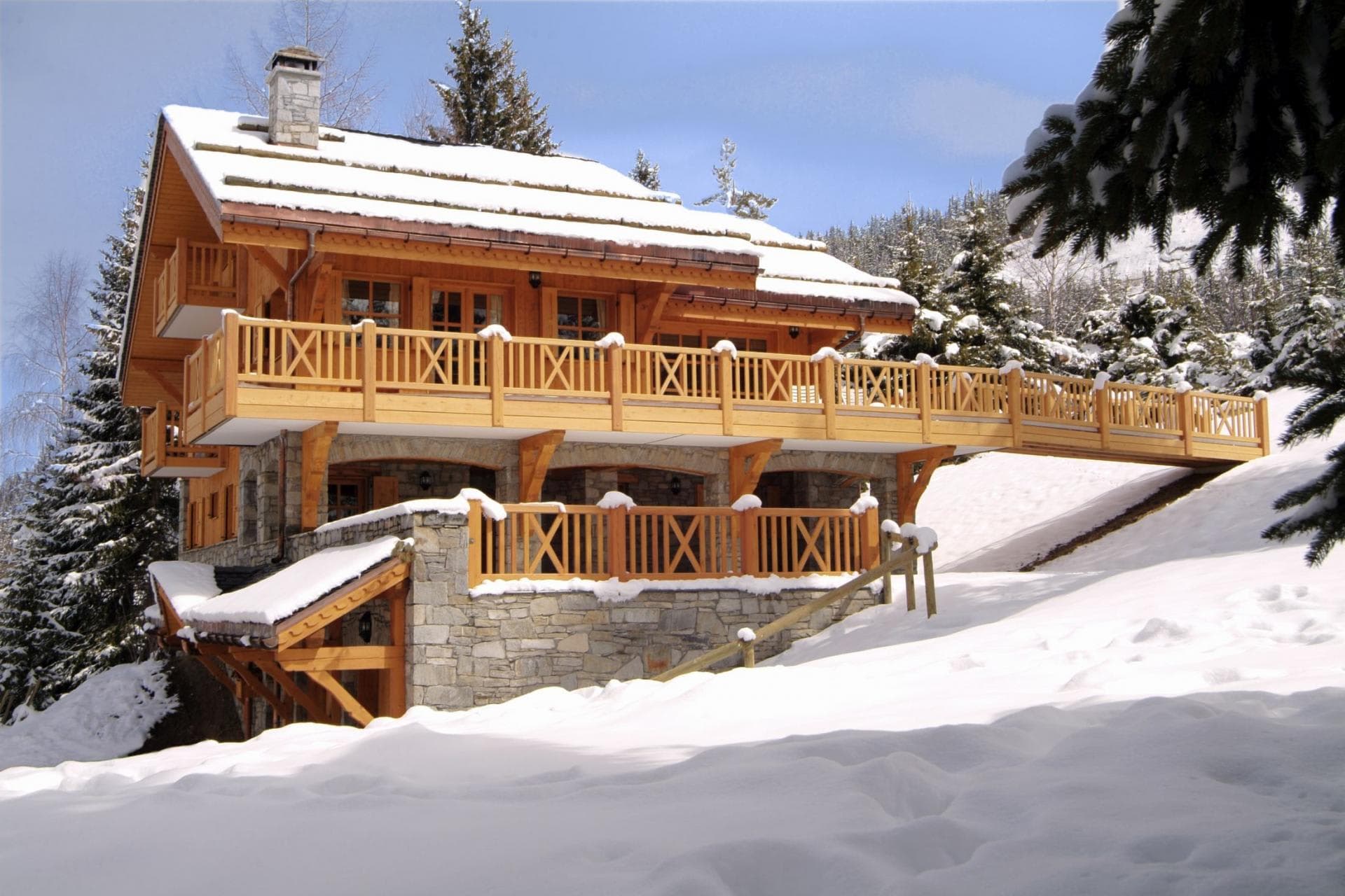Ski-in/ski-out chalet with wrap-around balcony and stone foundation