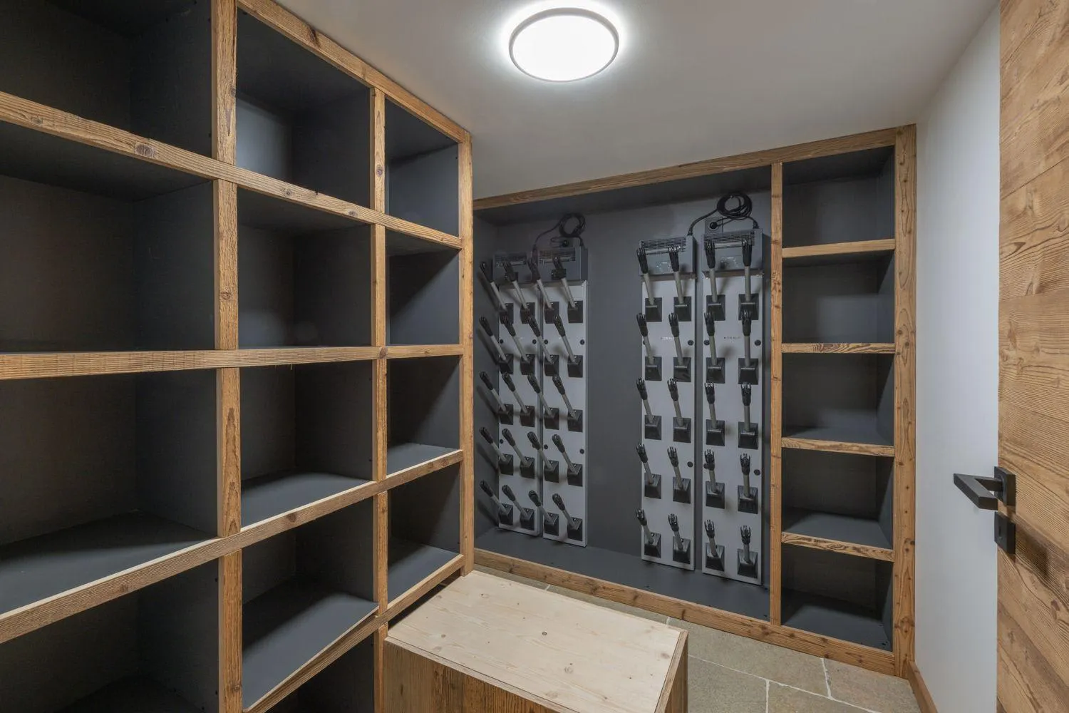 Ski room with equipment storage and heated boot dryers