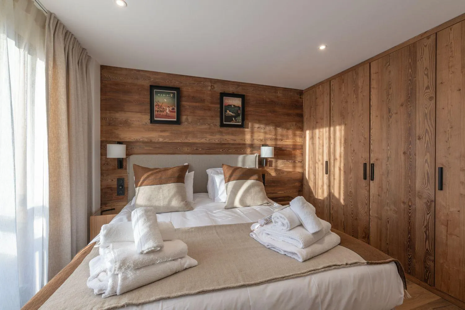 Double bedroom with built-in wardrobes and timber wall panelling