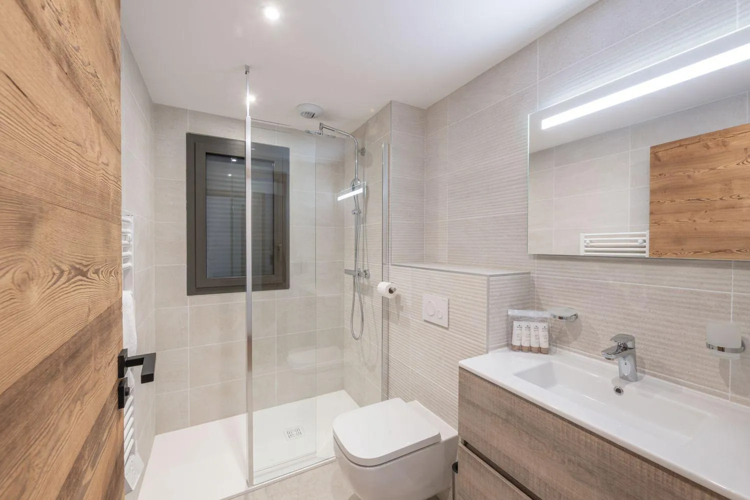En-suite shower room with a heated towel rail