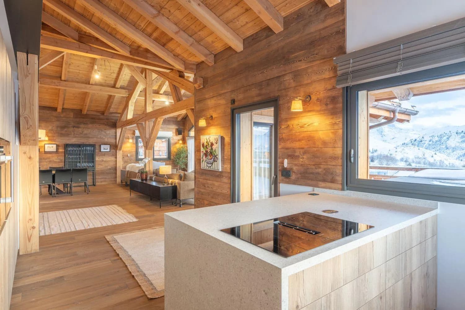 Open-plan kitchen island with an induction hob and mountain views
