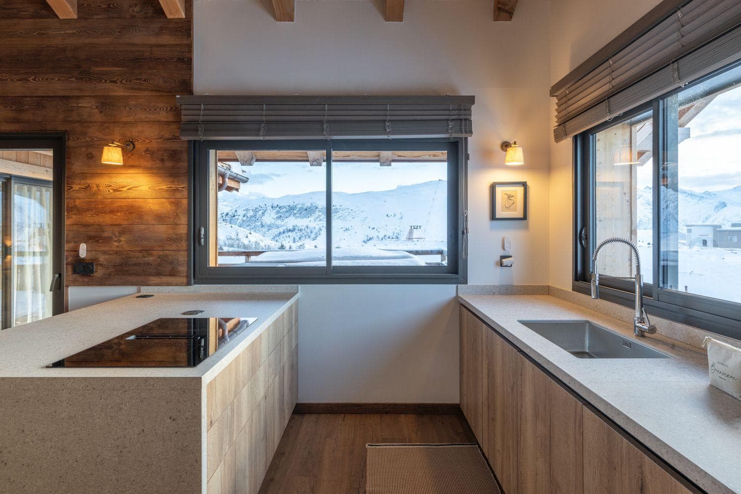 Kitchen with induction cooktop and mountain views from dual windows