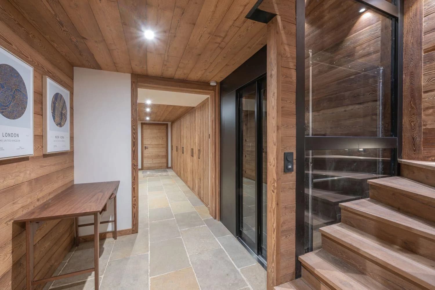 Hallway with private elevator access and built-in storage