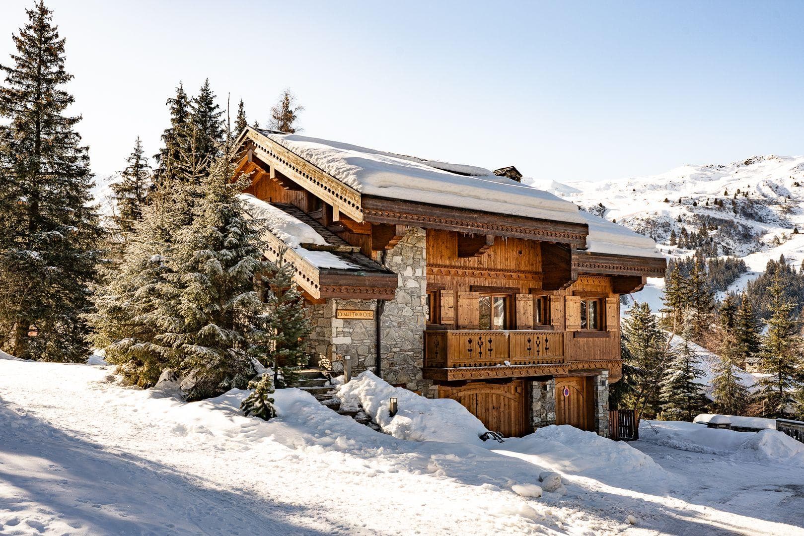 Ski-in/ski-out chalet exterior with private balcony and heated garage
