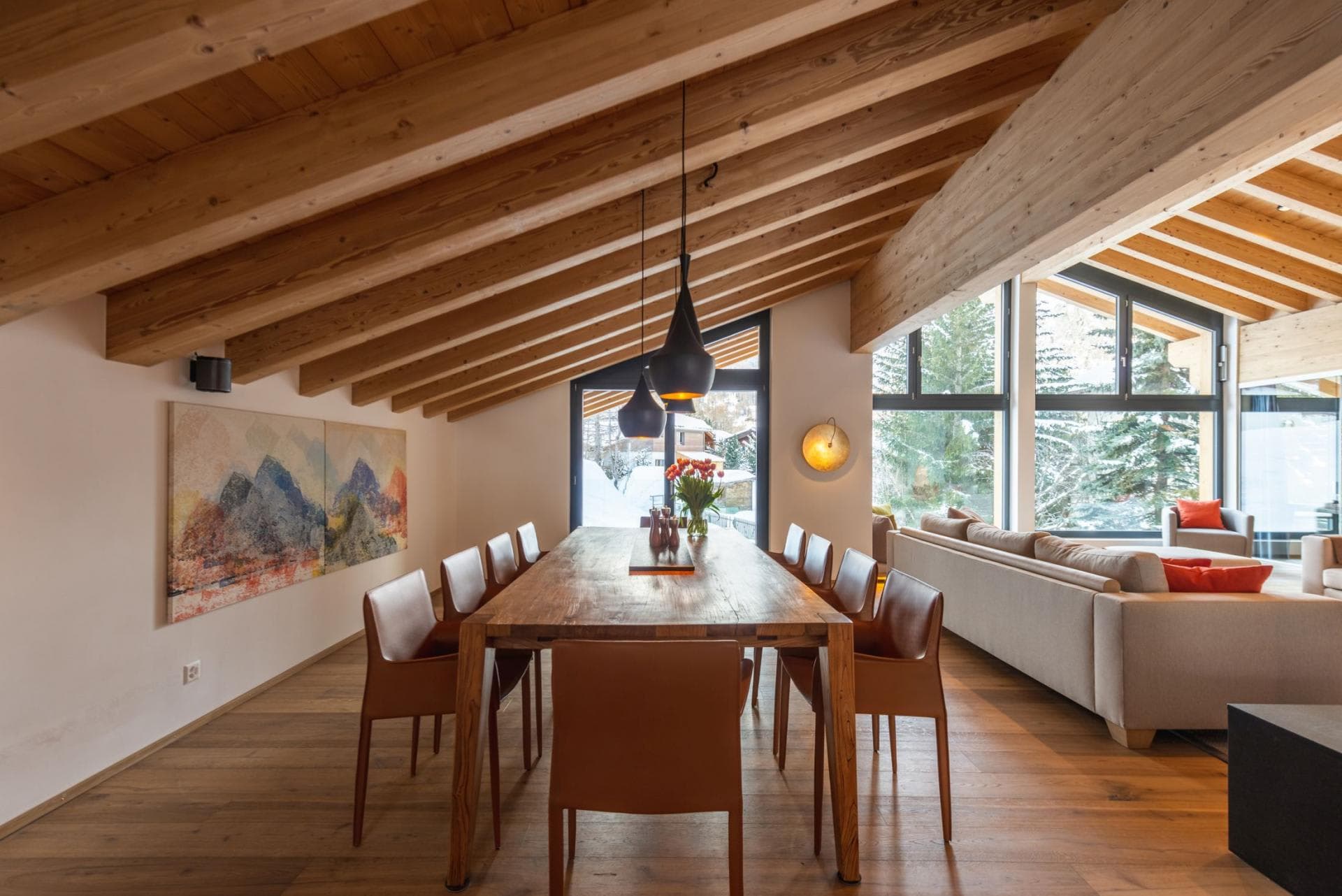 Dining area with seating for 10 and vaulted wood beam ceilings