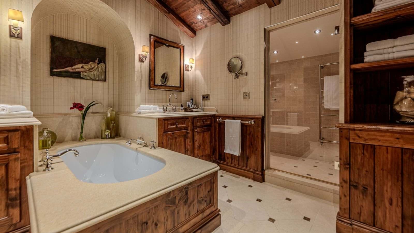 Bathroom with soaking tub and separate glass-enclosed walk-in shower