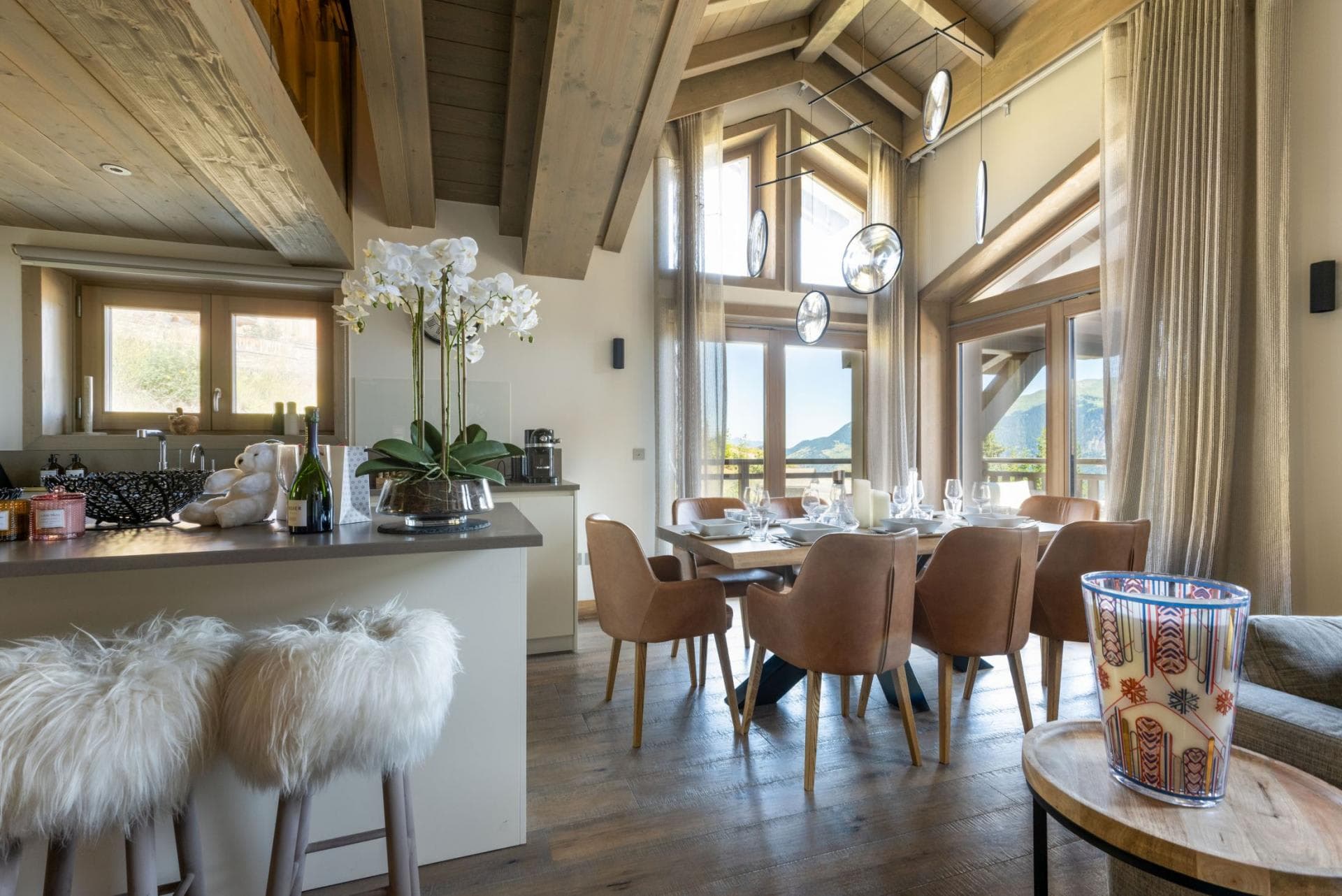 Dining table seats 8; vaulted wood ceilings and mountain views