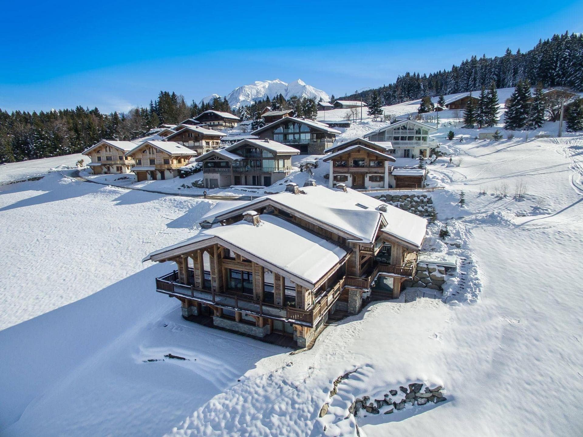 Mountain chalet with wrap-around balconies and direct ski-in/ski-out access