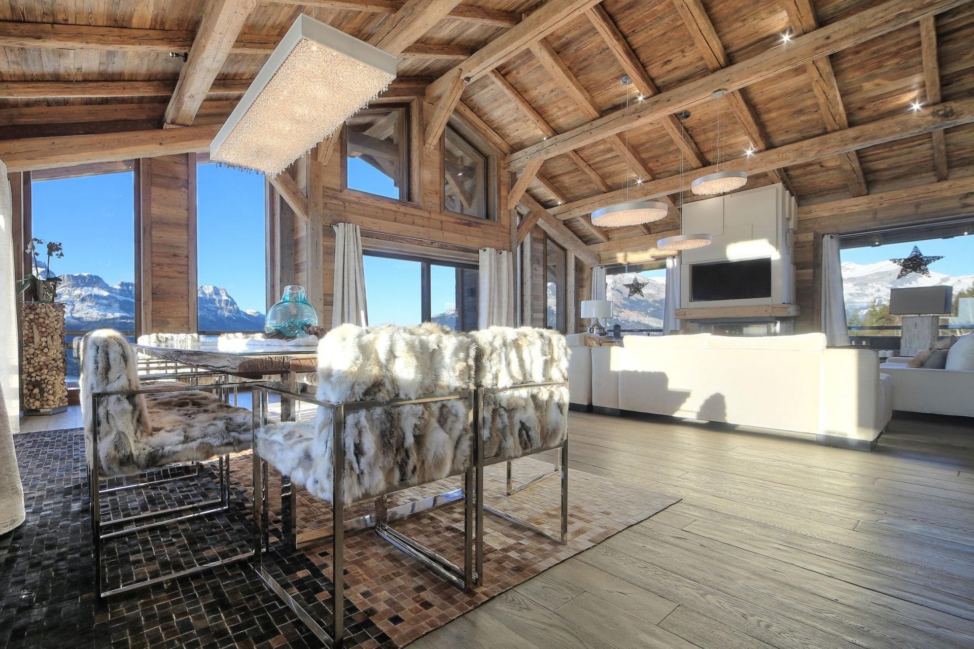 Open living area with vaulted wood ceilings and mountain views