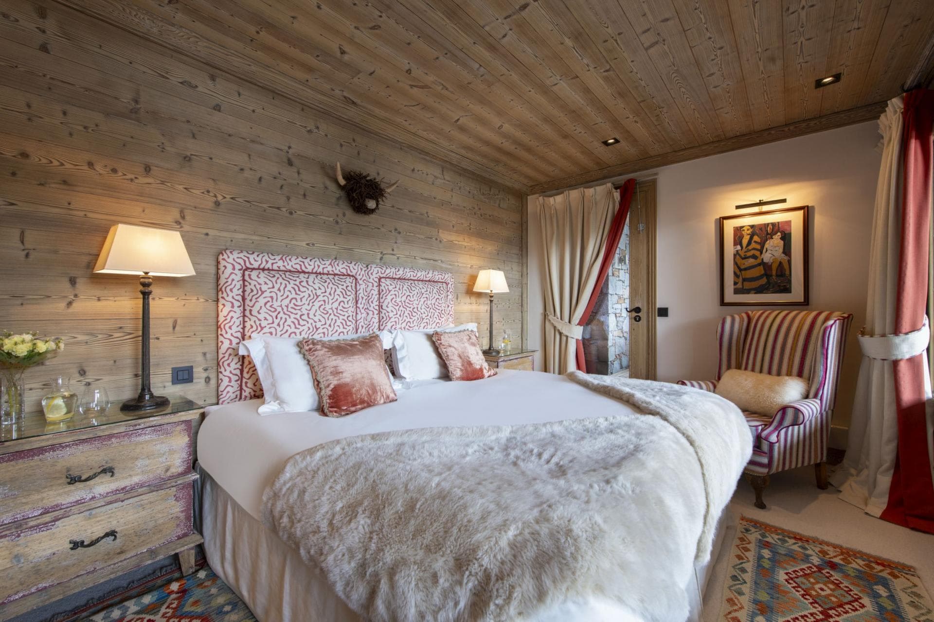 Guest bedroom with king bed and private balcony access