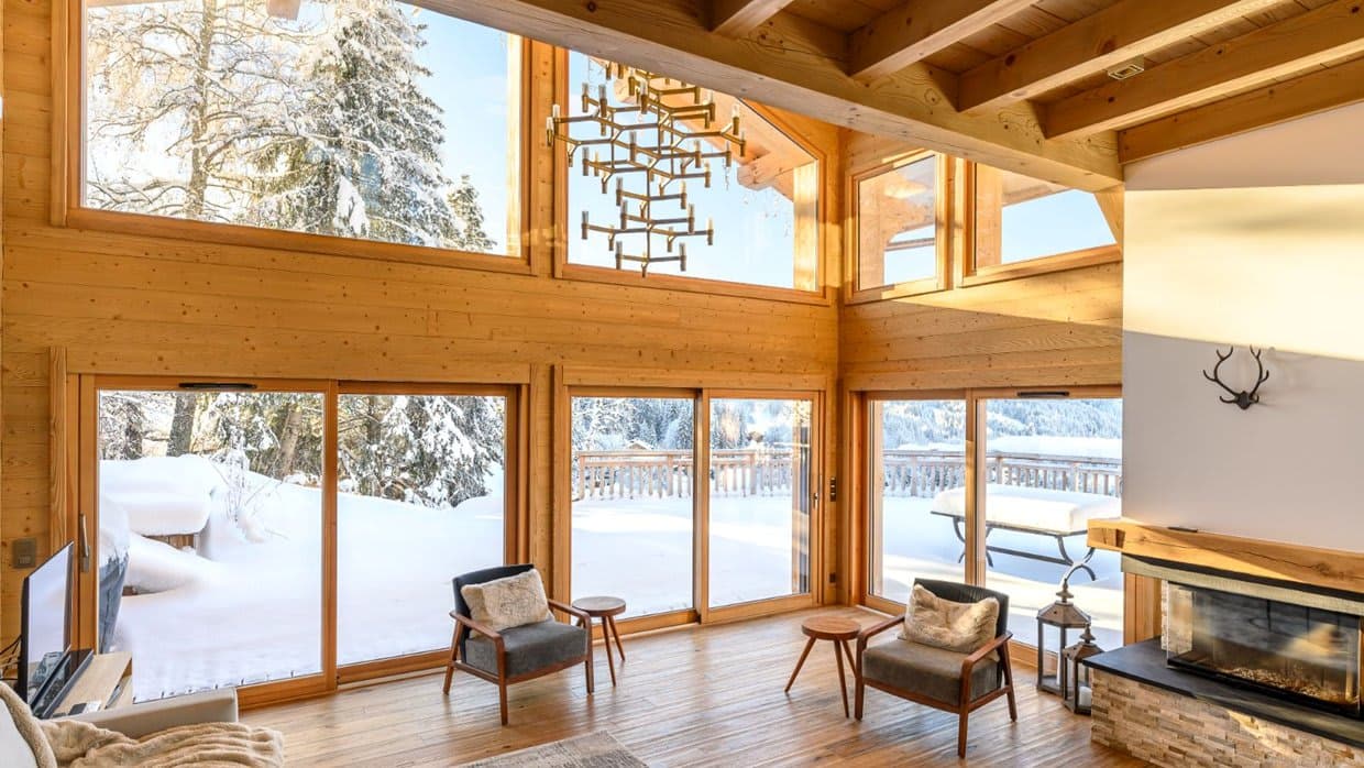 Living room with floor-to-ceiling windows and fireplace