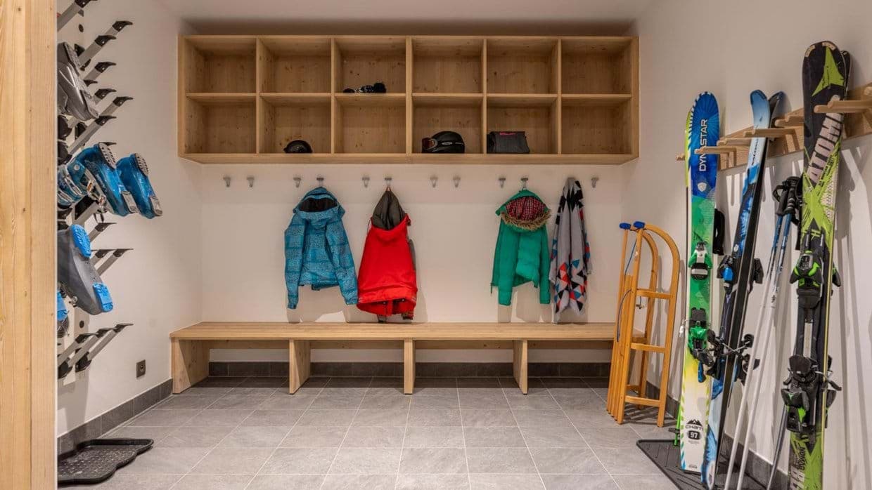 Ski room with heated boot dryers and 12 storage cubbies
