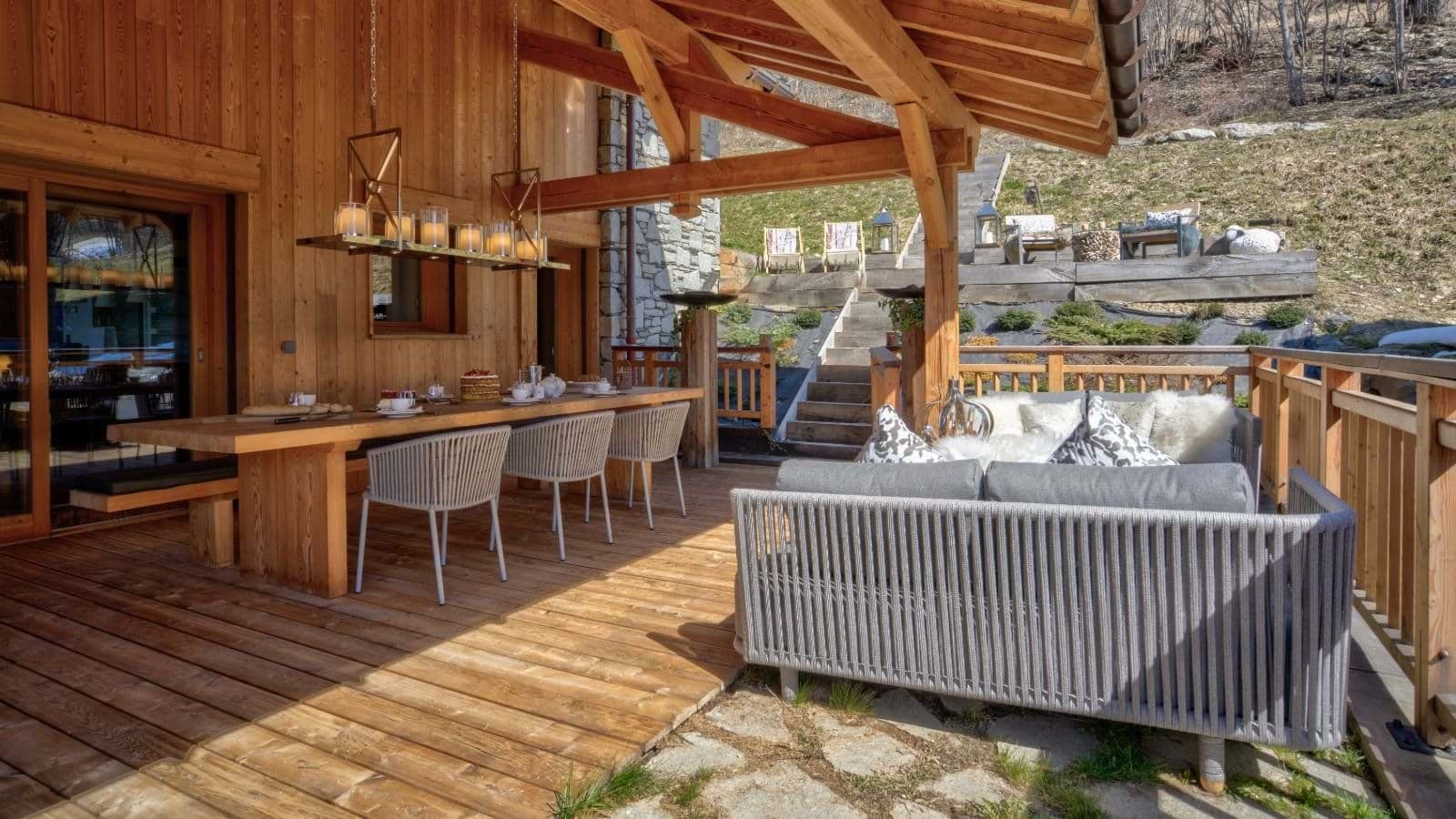 Covered deck with dining for 8 and additional lounge seating