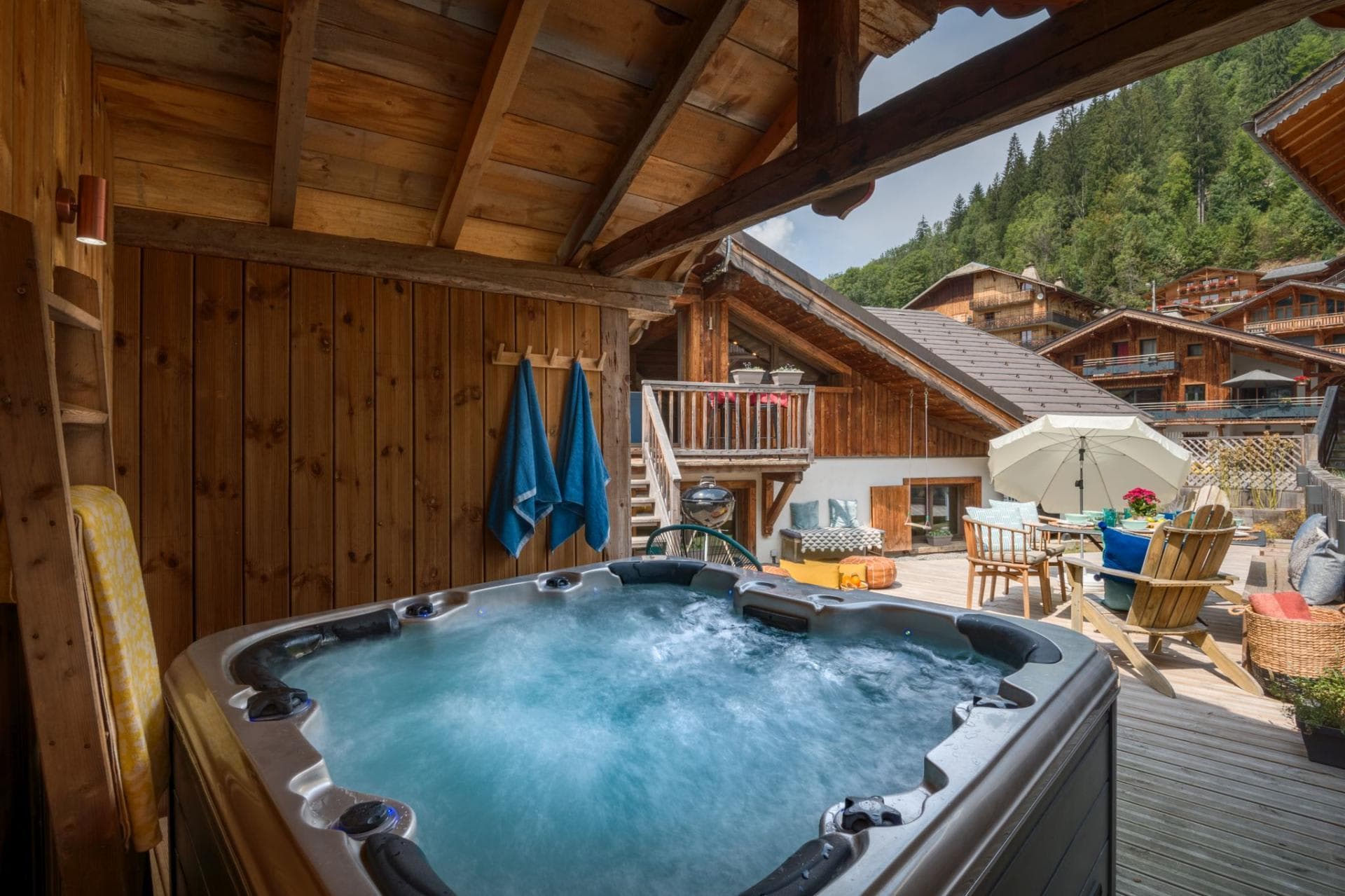 Covered outdoor hot tub seats 6; adjacent to dining deck