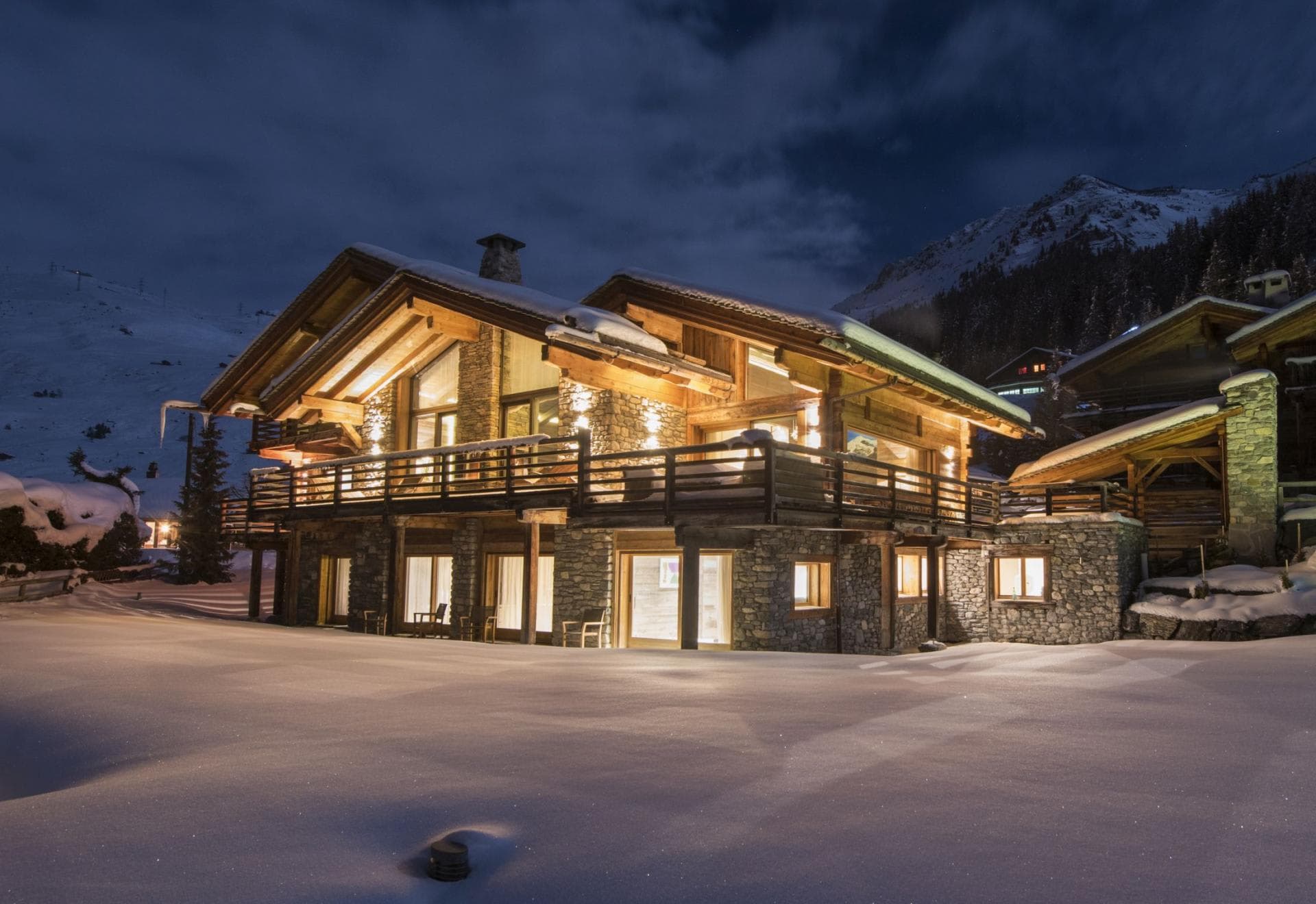 Ski-in/ski-out chalet with wrap-around balcony and stone exterior
