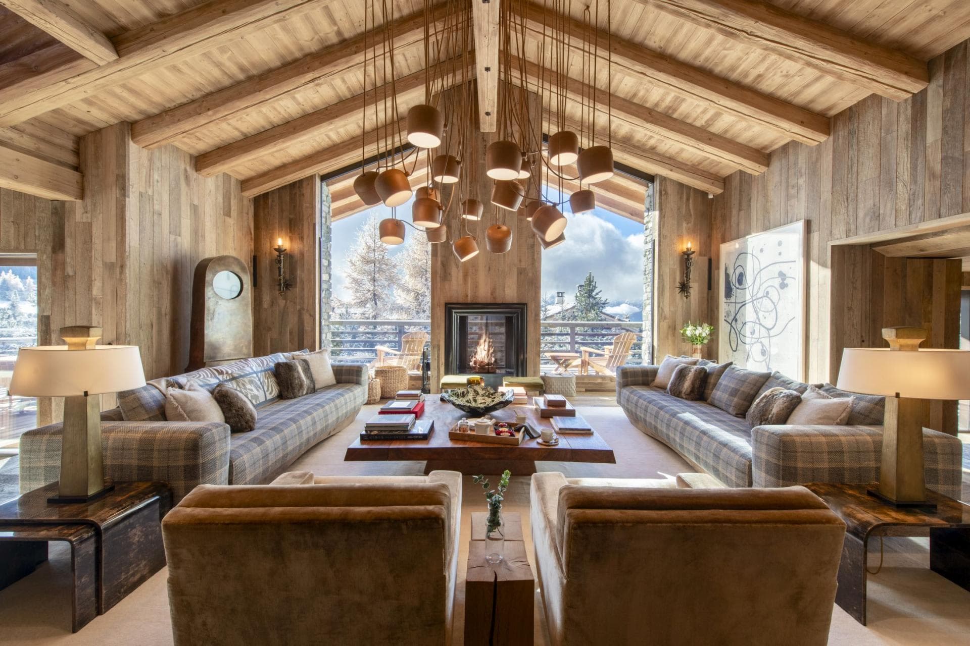 Living area with wood-burning fireplace and seating for 12; mountain views