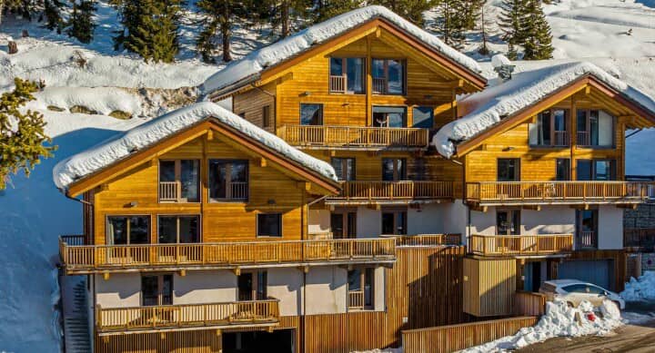 Ski-in/ski-out chalet exterior with multi-level balconies and private garage