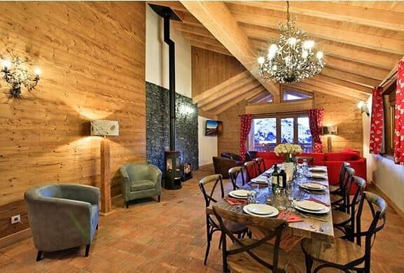 Open dining area with seating for 10 and wood-burning stove