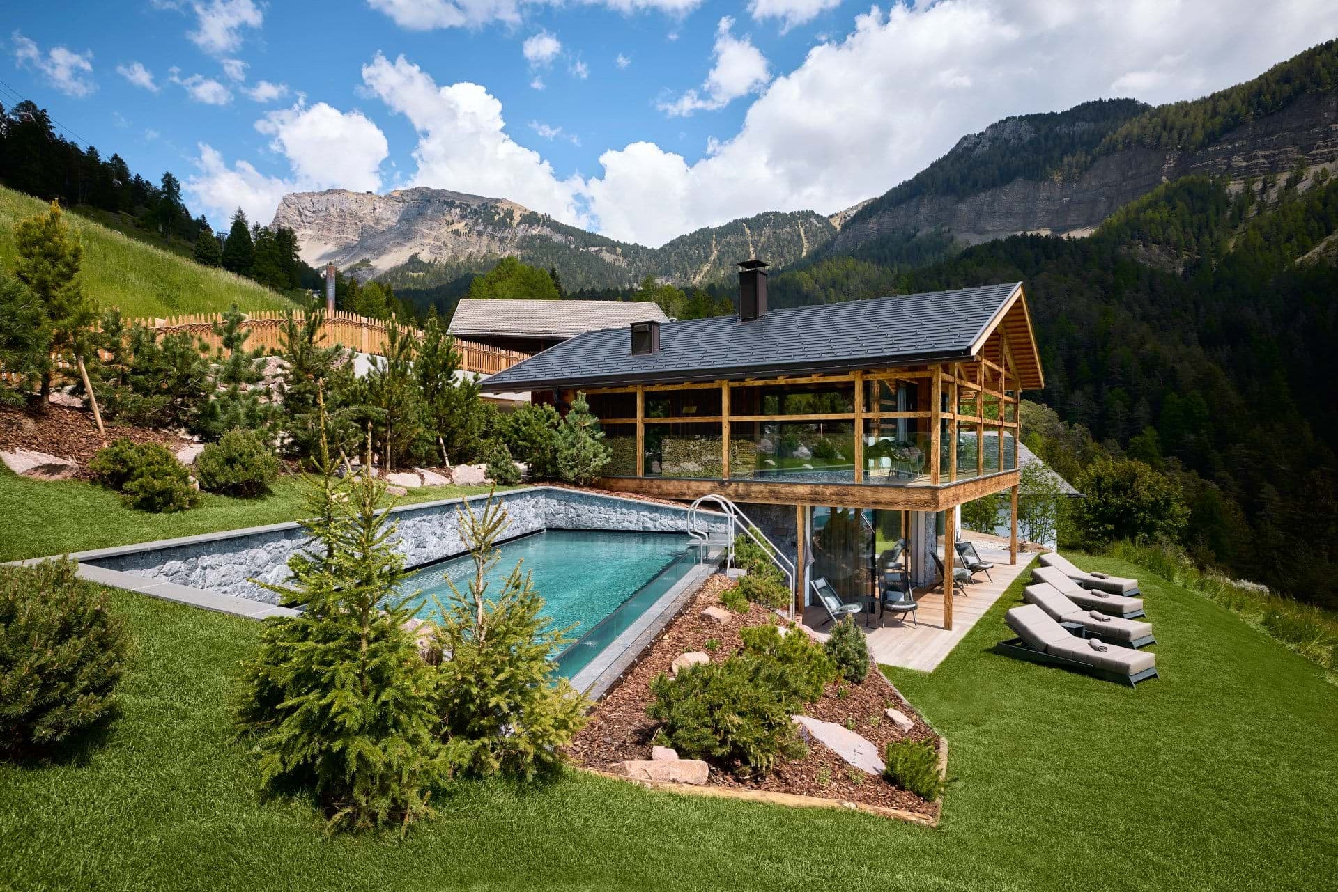Pool area with mountain views and four sun loungers