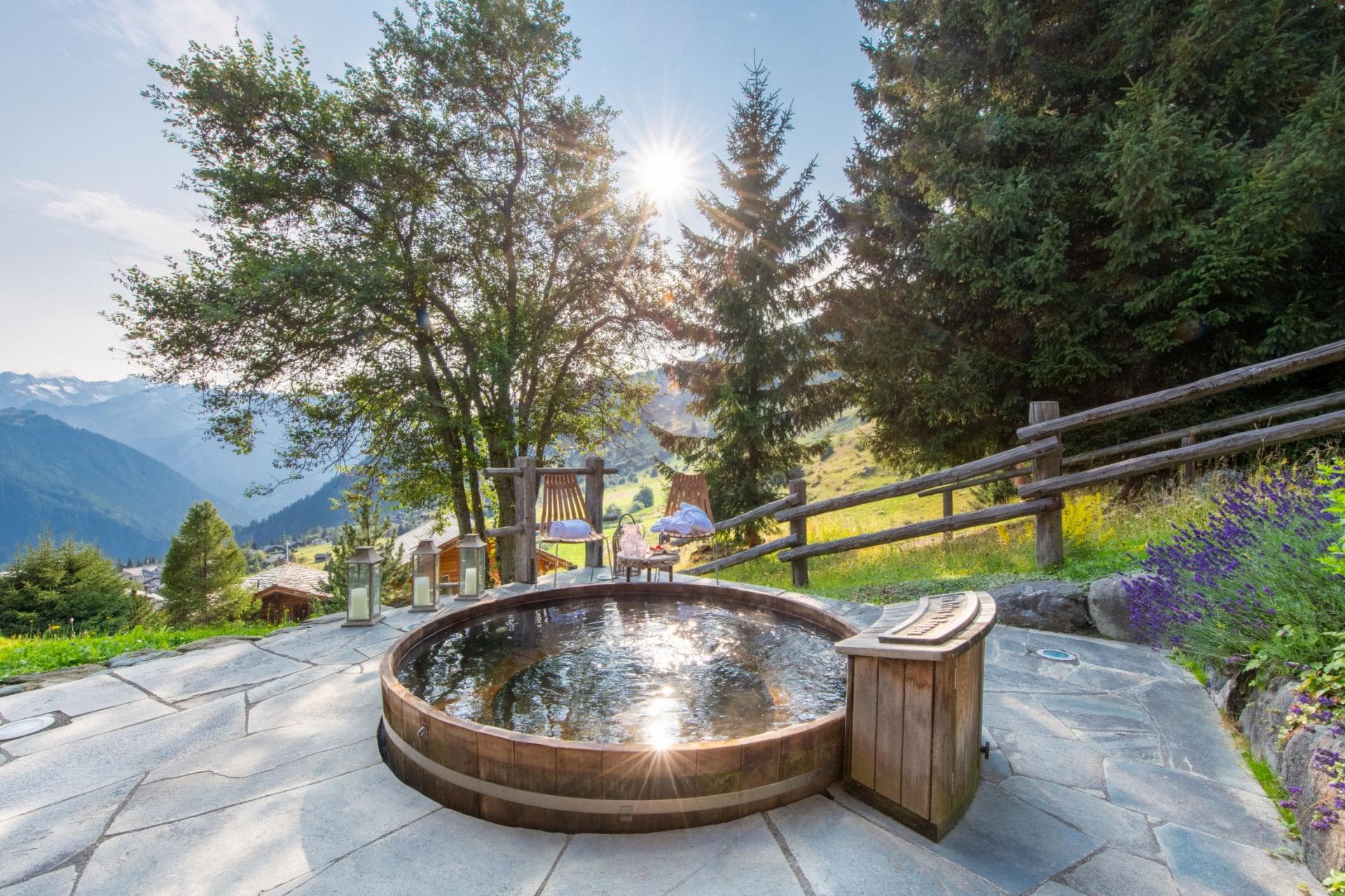 Cedar hot tub with mountain valley views and stone patio