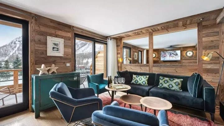 Living area with mountain views and direct balcony access