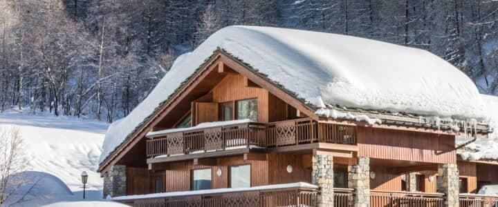 Ski-in/ski-out chalet with private balconies and stone pillar detailing