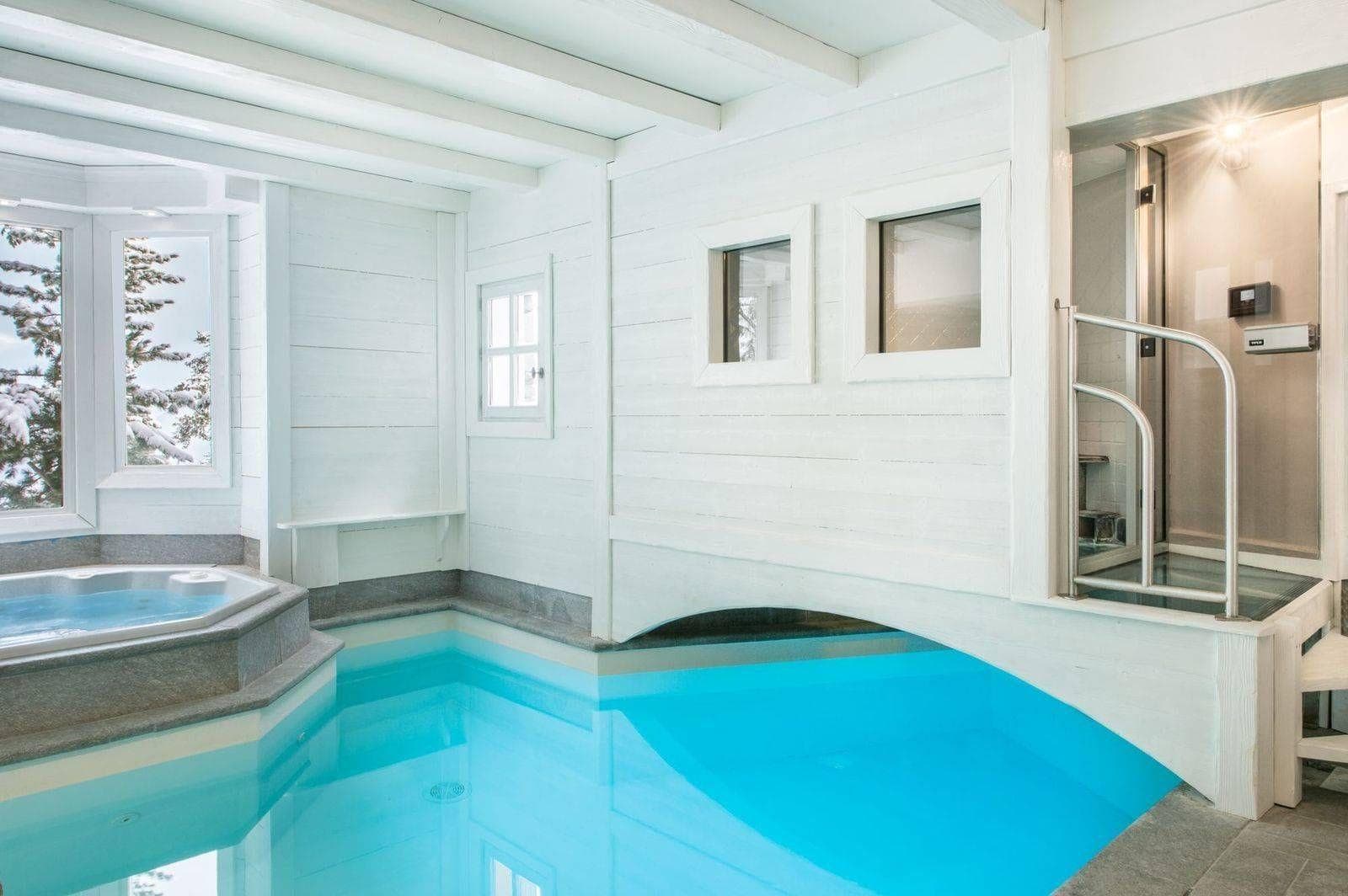 Indoor pool and hot tub with swim-under access to outdoor section