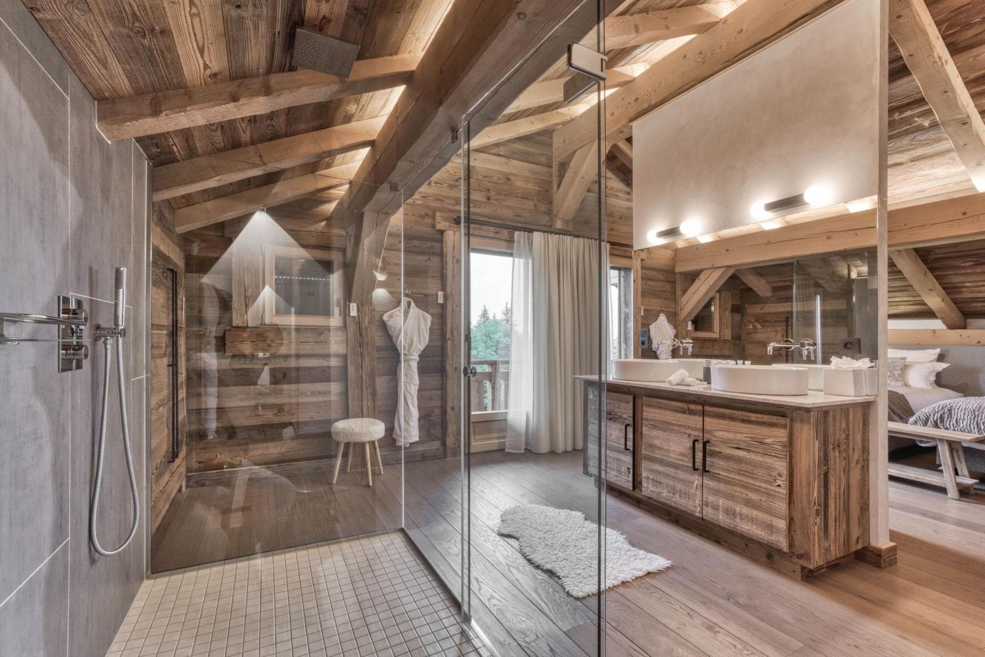 En suite bathroom with dual vanity and rainfall walk-in shower