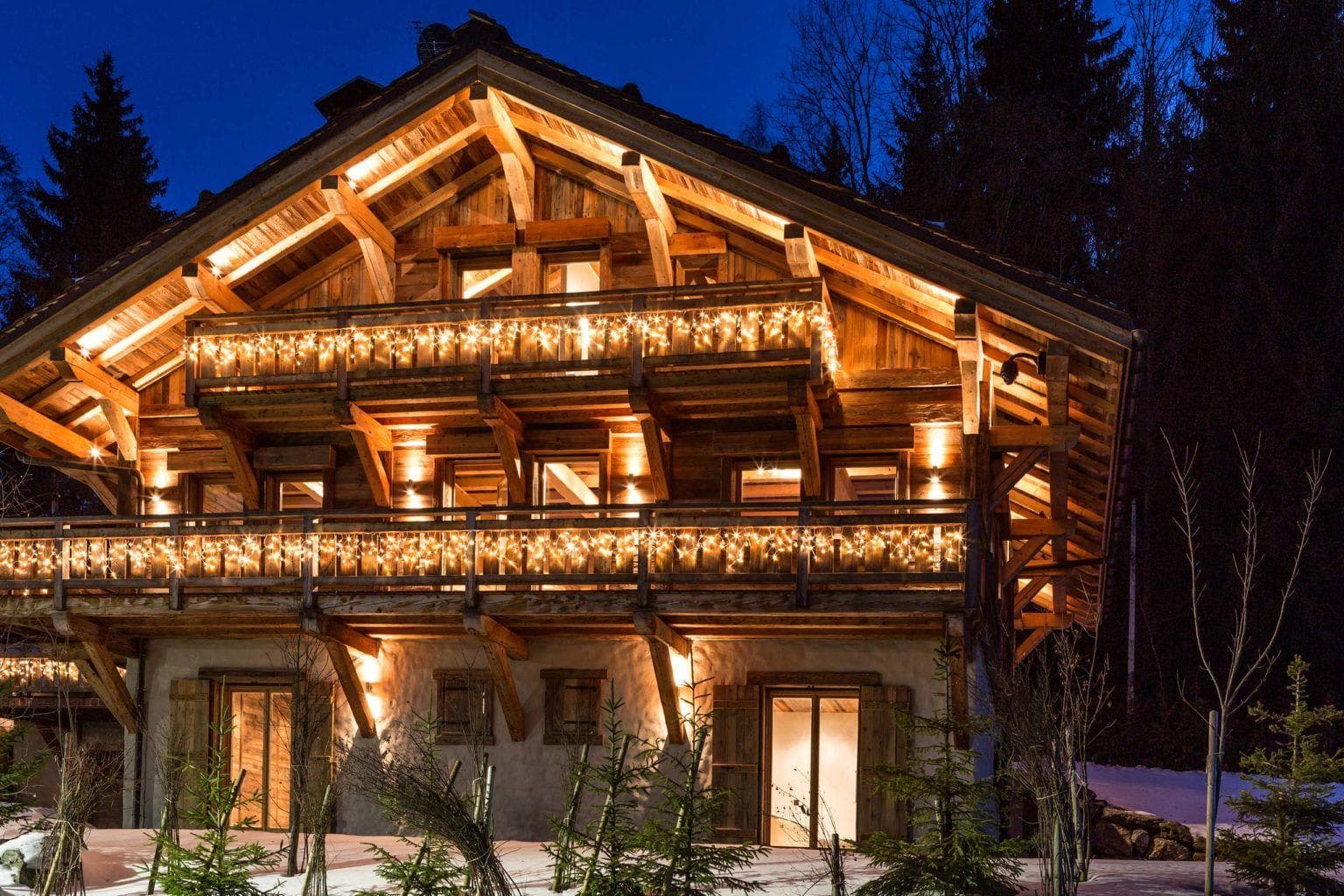 Timber chalet exterior with multi-level balconies and ski-in access